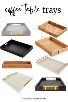 coffee table trays with gold trim and handles on them, including one that has the word