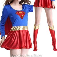 a woman in a superman costume is posing for the camera with her hands on her hips