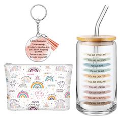 a glass jar with a keychain and a small pouch next to it on a white background