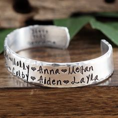 "Take a LOOK at our Website: ANNIEREH.com Personalized Grandma Bracelet, Grandmother Cuff Bracelet, Grandchildren's Names, Mothers Day Gift, Gift for Grandma,Christmas Gift for Her Customize our cuff bracelets with your favorite word/s, meaningful phrase, special saying, names of loved ones, grandchildren, dates and even coordinates for the place you met your partner or shared a special moment with someone. Let us know the Names/Wording for this cuff in our NOTE to seller box. We can also person Personalized Adjustable Bracelet As Gift For Mom, Adjustable Name Bracelet Ideal As Gift For Mom, Adjustable Name Bracelet Gift For Mom, Adjustable Personalized Bracelet As A Gift For Mom, Adjustable Name Bracelets As Gifts, Hand Stamped Name Bracelet For Mother's Day Anniversary, Adjustable Names Bracelet Perfect As Gift, Adjustable Bracelet With Names For Gifts, Personalized Adjustable Cuff Bracelet