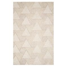 a beige rug with white triangles on it