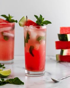 watermelon, cucumber and mint mojita cocktails on a marble table