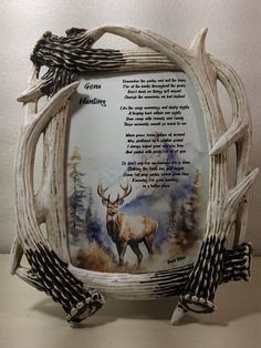 a deer with antlers on it's back and poem in the middle, sitting on a table