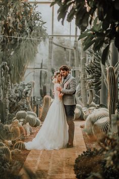 a man and woman standing in front of cacti with the caption instagram