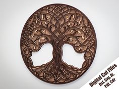 a wooden plaque with an intricate tree design on it's face and two faces in the center