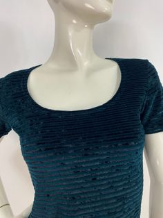 "90s top, 1990s green top, size small, spandex stretch  Measurements:  Shoulder 16\"-17\"/sleeve 7\"/bust(pit-pit)16\"/waist 13.5\"/bottom width 16\"/length 21\" Mannequin measurements:  5'8\", bust 34\", waist 25\", hip 33\" Please note that vintage clothing sizes can vary greatly.  The Measurements provided  are approximate and are taken lying flat.  I suggest taking a similar garment from your wardrobe and measure it while lying flat.  This way you can compare measurements.  All of our pieces Button Front Skirt, Corduroy Coat, Black Sleeveless Top, Vintage Floral Dress, 70s Dress, Green Tops, Black Sleeveless, Wool Plaid, Wearing Dress