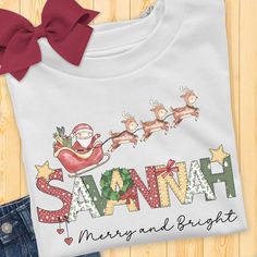 Long Sleeve Toddler Christmas Shirt for boys or girls. A delightful and personalized garment that will bring extra joy to your child's Christmas. This charming Christmas t-shirt showcases the festive phrase "Merry and Bright," capturing the essence of the holiday season. But what makes it truly special is the adorable doodle of Santa Claus taking off in his sleigh, guided by his faithful reindeer. It's a whimsical scene that will ignite the imagination and fill hearts with holiday cheer. To make Doodle Name, Toddler Christmas Shirt, Christmas Doodle, Denim Hoodie, Christmas Doodles, Charming Christmas, Christian Sweatshirt, Long Sleeve Kids, Toddler Christmas