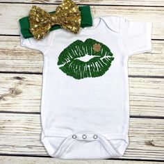 Kiss Print with clover design in green and gold glitter lettering. Your choice of purchasing just the bodysuit, or the bodysuit and bow headband. I use Laughing Giraffe bodysuits and they fit true to size with room to grow. Machine washable. Short and long sleeve options available 2T through 5T T-shirts also available Carters Baby Girl Clothes, Kiss Print, Bodysuit Outfit, St Patrick's Day Outfit, Clover Design, Saint Patties, Body Suit Outfits, Lips Print, March 2023