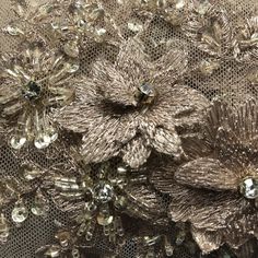 Handmade, high quality Beaded 3D Floral Lace Fabric Embroidered on 100% Polyester Net Mesh. Durable heavy weight fabric. Beautiful on wedding dresses, evening gowns, dance costumes, and more. Content: 100% Polyester / Minimum Order: 1 Yard / Size: Approximately 48" Wide / Ships within 24 business hours. Colors: This product comes in 2 different colors. Embellished Embroidered Fabric For Wedding, Elegant Embroidered Lace Fabric For Celebration, Elegant Embellished Embroidered Fabric, Elegant Embellished Embroidered Fabric For Festive Season, Elegant Embellished Embroidered Fabric For Celebration, Elegant Floral Embroidered Festive Fabric, Elegant Floral Embroidered Fabric For Festive Season, Elegant Floral Embroidered Fabric, Elegant Floral Embroidered Fabric For Party