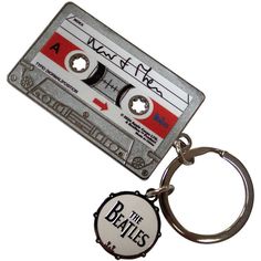 a keychain that has an old school cassette tape on it with the word'the beatles'printed on it