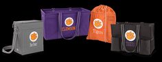 four bags with clemson logos on them are lined up in the same color as each other