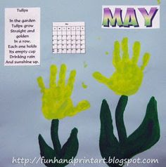 a bulletin board with handprints on it and the words may written in green