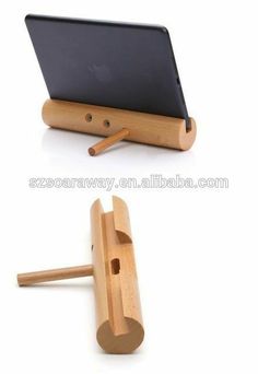 an ipad stand with a tablet on it and a wooden holder for the back cover