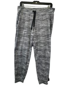 Brand: LULULEMON Style: ATHLETIC PANTS Color: GREY & SILVER Size: M Other Info: AS IS SKU: 311-31123-16176 CONDITION: LIKE NEW Casual Gray Yoga Pants For Gym, Casual Gray Yoga Pants For Sports, Casual Gray Yoga Pants For Workout, Gray Go-dry Casual Sweatpants, Casual Gray Joggers With Go-dry Technology, Casual Gray Go-dry Sweatpants, Casual Go-dry Yoga Pants For Loungewear, Sporty Gray Yoga Sweatpants, Sporty Gray Sweatpants For Yoga