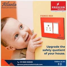 a baby is holding on to a red switch box