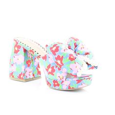 Step Into Bold Prints With Our Satin Embellished Platform Sandal. These Heels Feature A Stable Block Heel With Playful Prints Topped Off With An Oversized Bow To Add A Touch Of Feminine Flair To Your Look. Features - Satin Textile Upper Material With Embellishments - Slip-On Style - Synthetic Lining/Sock - Synthetic Sole - 3.5 Inch Heel Height - .75 Inch Platform Brand: Betsey Johnson Style: Maccie Color: Blue Multi Width: Medium Heel Height: 3.75 Inches Material: Fabric Condition: New With Box Spring Embellished High Heel Sandals, Embellished High Heel Sandals For Spring, Blue Embellished Sandals For Spring, Spring Embellished Blue Sandals, Spring Blue Embellished Sandals, Chic Embellished Sandals For Spring, Chic Fabric Heels For The Beach, Chic Fabric Heels For Beach, Spring Embellished High Heels