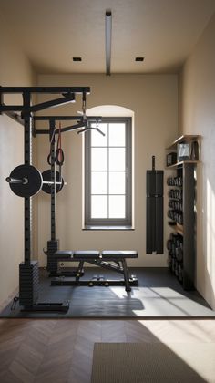 an empty gym room with equipment in the corner and sunlight coming through the window on the far wall