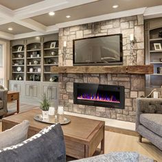 a living room filled with furniture and a fire place in front of a flat screen tv