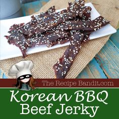 korean bbq beef jerk recipe on a white plate with the title above it and an image of a woman wearing a chef's hat