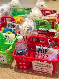 several plastic baskets filled with candy and snacks