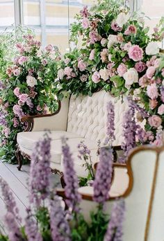 an instagram photo with flowers on the couch and in the background is a window