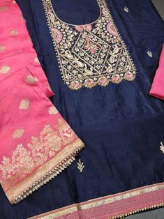 Item Overview ATHARVA Hand Embroidere Salwar Kameez With Beautiful Neck Embroidery in navy Blue and Banarsi Silk Dupatta in Dark Pink. - Dno. CH1068 Fabric: * Shirt Chanderi in Navy Blue 2.5 Mts, * Dupatta: Banarsi Silk in Red 2.5 Mts. Motifs May Wary * Bottom Santoon Silk 2.5 Mts. Excusive Hand Embroidered Party Wear Punjabi Suit. Customization: * Fabrics: Designs Can be made in different Fabrics. * Stitching Available Care: * Dry Clean/ Avoid direct Ironing on Embroidery Part. * You will need Blue Chanderi Fabric With Dabka Work, Blue Chanderi Fabric With Dabka Embroidery, Blue Bollywood Embroidered Fabric For Straight Kurta, Blue Raw Silk Salwar Kameez With Embroidered Border, Blue Bollywood Embroidered Straight Kurta Fabric, Blue Dola Silk Salwar Kameez With Chikankari Embroidery, Blue Salwar Kameez With Chikankari Embroidery In Dola Silk, Traditional Blue Embroidered Churidar, Traditional Royal Blue Salwar Kameez For Diwali