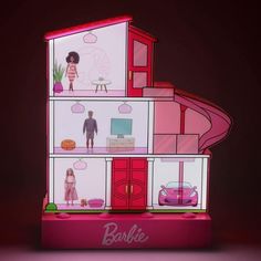 the barbie doll house is lit up with pink lighting