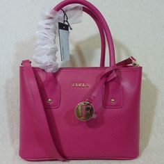 Brand New Never Been Carried Classic Josi Small Tote By Furla. This Bag Is Made Of Pink Saffiano Leather Dimensions: 10" Wide Across X 7.5" Tall Center X 4" Deep. Double Handle 4" Drop. You Can Only Carry It Over The Shoulder If You Have Small Arms. Comes With Long Detachable Shoulder Strap Center Zipper Bonus Compartment 2 Slip Pockets And 1 Zipper Pocket Furla Logo Fabric Lining. Gold Tone Metalware. Comes Complete With It's Dustbag And Care Card Furla Bags, Leather Tote Bag Women, Large Leather Tote Bag, Genuine Leather Totes, Large Leather Tote, Convertible Bags, Leather Handbags Tote, Care Card, Small Tote