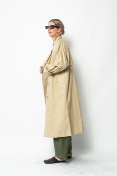 Classic mid-weight cotton trench jacket with seamed raglan sleeve detail. Jacket features adjustable button cuff, contrast binding finishing inside, welt pockets and a central back vent. 100% Cotton Made in India Khaki Long Coat With Button Cuffs, Classic Cotton Outerwear For Daywear, Classic Gabardine Outerwear For Daywear, Classic Outerwear With Button Cuffs, Classic Outerwear With Button Cuffs For Daywear, Classic Khaki Outerwear With Button Cuffs, Classic Long Sleeve Raincoat For Work, Classic Khaki Outerwear With Belted Cuffs, Classic Oversized Outerwear With Belted Cuffs