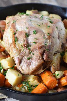 a pot roast with potatoes, carrots and meat