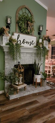 a living room filled with furniture and a fire place covered in potted greenery