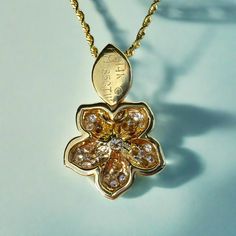 Pua’ahi (Fire Flower) pendant in 14K Yellow Gold with 25x .03ct & 1x .12ct Diamonds. Total Diamond weight .85ct. Leaf bail. Approx. 16.5mm wide. Sold as seen. All Sales Final. No returns or exchanges. Chain sold separately. Pictured with 14K Yellow Gold 1.5mm 16'' Rope Chain (RC29).Item Numbers: PD1-D-V Gold Brilliant Cut Flower Pendant Jewelry, Gold Flower Pendant With Brilliant Cut, Gold Flower-shaped Jewelry With Brilliant Cut, Gold Jewelry With Brilliant Cut Flower, Gold Brilliant Cut Flower Jewelry, Fine Jewelry In Yellow Gold With Flower Shape, Yellow Gold Flower Pendant Jewelry With Brilliant Cut, 14k Gold Flower-shaped Jewelry With Brilliant Cut, Exquisite Yellow Gold Flower-shaped Jewelry