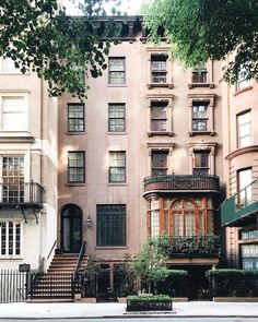 an apartment building with many windows and balconies