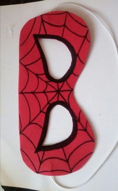 a cake that is shaped like a spider man