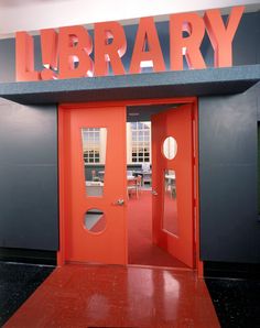 an orange door with the words library on it