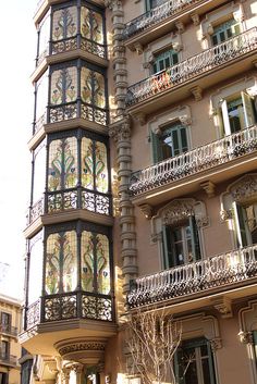 an ornate building with balconies and balcony railings on the side of it