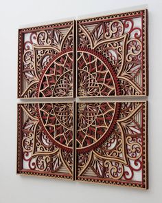 two pieces of art made out of wood with intricate designs on the sides and bottom