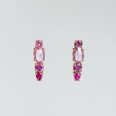 Our splice cluster earrings have been set with shades of pink Sapphires. Earrings measure 19mm long. Sold as a pair.