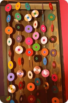 an assortment of colorful donuts hanging from strings