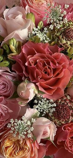 a large bouquet of pink and red flowers