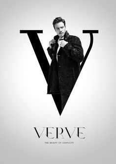 a man is standing in front of a v logo