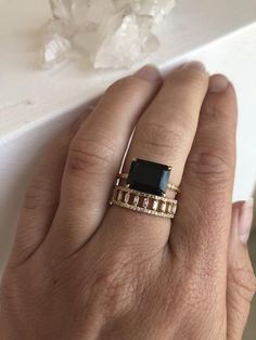 Spin off of our best-selling Onyx Ring, this 3.8ct emerald cut Black Onyx is set horizontally for more unique feel. Set into our signature claw prongs. Subtle, quarter band diamonds, 0.08ct.  Treat with love due to the center stone softness. Band width, 1.5mm In stock: 14k Yellow  Gold Elegant Stackable Emerald Cut Rings, Elegant Stackable Rings With Emerald Cut, Luxury Gemstone Stackable Rings For Formal Occasions, Elegant Stackable Rings With Accent Stones For Formal Events, Elegant Stackable Rings With Accent Stones For Formal Occasions, Elegant Emerald Cut Gemstone Stackable Rings, Elegant Stackable Sapphire Ring For Formal Occasions, Luxury Stackable Emerald Ring, Elegant Emerald Ring For Wedding