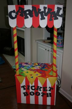 a carnival ticket booth made out of cardboard