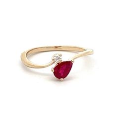 Make a statement with this 14k yellow gold ruby bypass ring. The ring features a pear-shaped ruby weighing 0.03 carats. A bold and elegant piece of jewelry for women. Colored Stone Rings, Bypass Ring, Jewelry For Women, Woman Colour, Pear Shaped, Stone Rings, Stone Color, Pear, Ruby