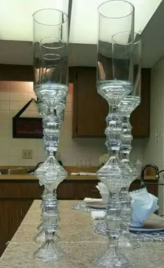 two clear wine glasses sitting on top of a counter