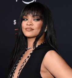 a close up of a person wearing a black dress and choker on her neck