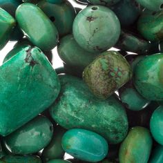 some green and brown rocks on a white background