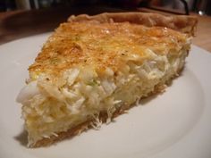 a piece of quiche on a white plate