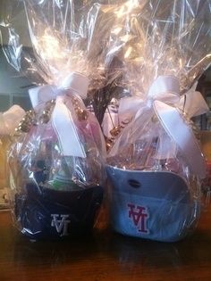 two baskets filled with candy and candies on top of a table