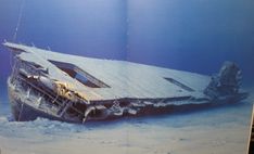 a large boat sitting on top of snow covered ground